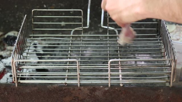 Preparation of roasted meat on the fire outdoors for a picnic and relax.