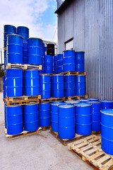 Blue metal fuel tanks of oil stored at the production site