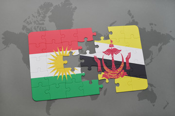 puzzle with the national flag of kurdistan and brunei on a world map background.