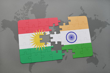 puzzle with the national flag of kurdistan and india on a world map background.