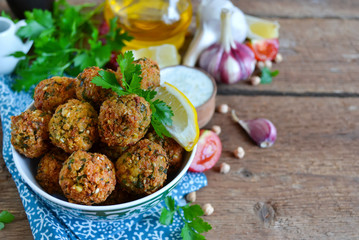 Falafel - deep fried balls of ground chickpeas with tahini sauce
