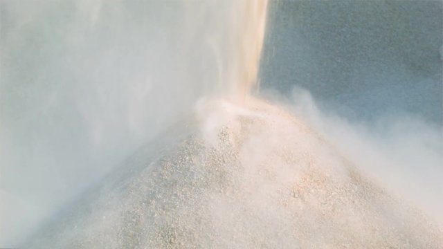 High definition video - Machine pours pile of granite gravel