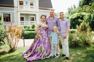 Fototapeta premium Portrait of Happy Family In Park - outdoor shot
