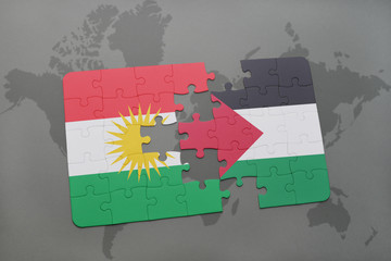 puzzle with the national flag of kurdistan and palestine on a world map background.