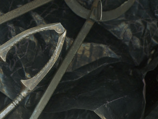 Grunge black still life with pin tied in a knot
