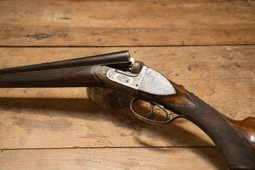 Aluminium Prints Hunting Vintage hunting gun on a wooden background