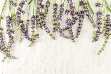 Lavender flower branches on  wooden table