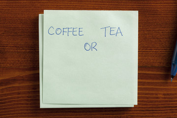 Coffee or tea written on a note