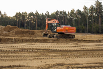 Obraz premium heavy organge excavator