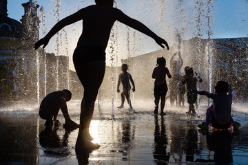 Children playing in a fountain