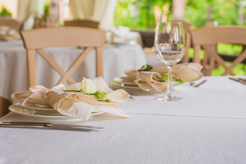 flower composition and candles in the restaurant. Wedding dinner