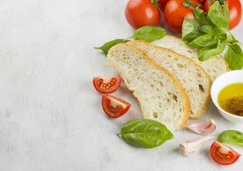 Italian food: ciabatta, basil, tomatoes, garlic, pepper, olive o