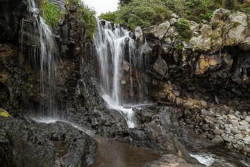 Fototapeta na wymiar View of Sojeongbang Falls on Jeju Island in South Korea.