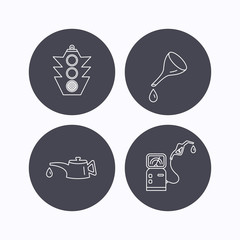 Motor oil, traffic lights and gas station.