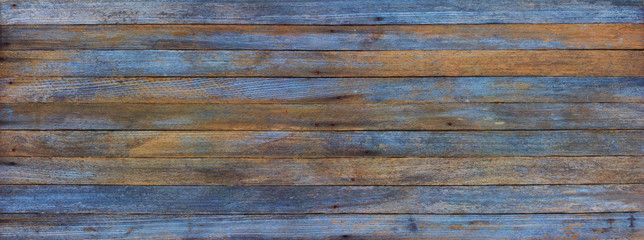 panoramic grunge background of old wood boards tinted photo