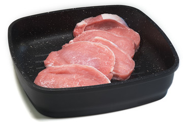 Five slices of meat on the frying pan.