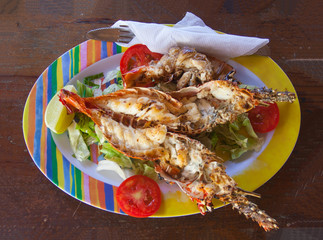 freshly caught grilled lobster served in a colorful dish