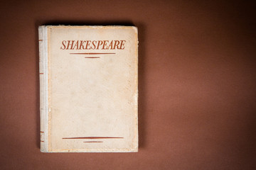 A Book by Shakespeare on Vintage Background
