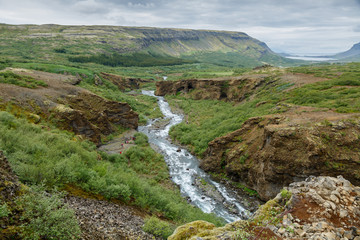 Fototapeta na wymiar Looking down in the valley from the highest waterfall of Iceland Glymur 