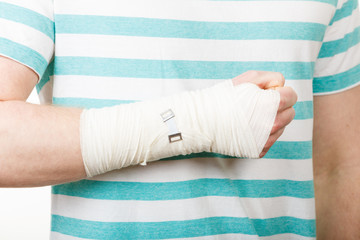 Obraz premium Part body man with bandaged hand.