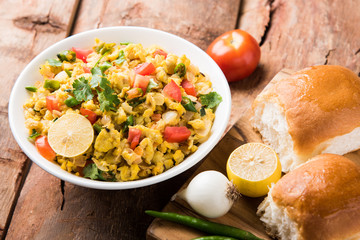Masala Anda Bhurji of egg bhurji or Spicy scrambled eggs with bread or pav or paav slices and...
