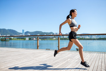 Young woman running at outdoor