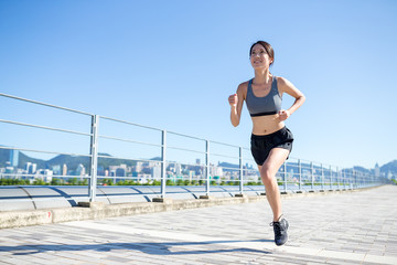 Young woman running at outdoor