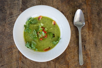 Soup gazpacho on wooden table, close up