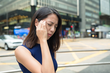 Woman feeling headache