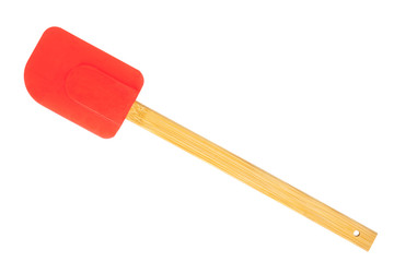 Red silicon spatula with wood handle.