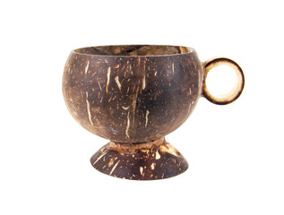 Coconut shell cup with wooden handle isolated on white backgroun
