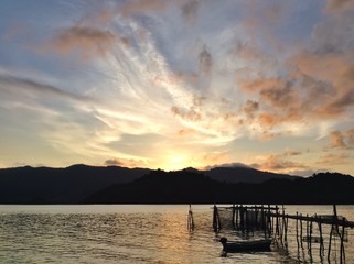 Sunrise at island and wooden bridge,colorful sky on dawning times at sea
