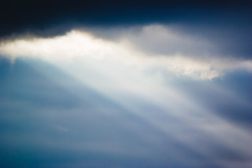 The sun's rays through the clouds in the sky on the peninsula Jandia. Fuerteventura. Canary Islands. Spain