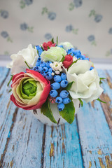 composition of different flowers in a pot