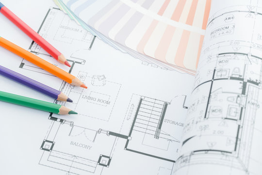 architects workplace - architectural drawings of the modern house with color pencils and sample colors. decoration concept. designer tools.