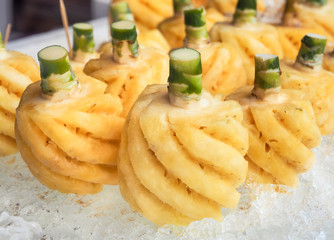 Pineapple fruit on ice in the market, Close up and selective focus 