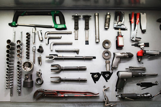 Professional mechanical tools in modern auto service. Set of different instruments in big workshop