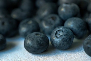 Macro image of blueberry pile on wooden table