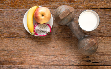 Iron dumbbell and  milk with fruit (banana,appke,dragon fruit) o