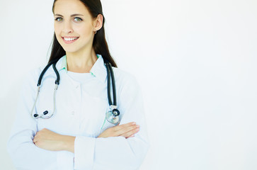 Young female medical doctor with crossed hands isolated. Advertisеment concept.