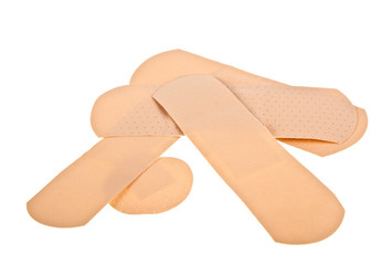 Heap of different adhesive plaster isolated on white background