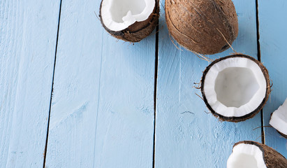 fresh coconuts on blue wooden table
