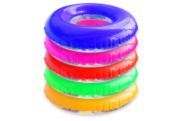Stack of colorful swim rings isolated on white background.