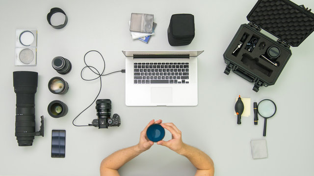 The Man Work With Camera Tool On The Desktop. Wide Angle