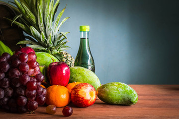 many fruits on the wooden floor.