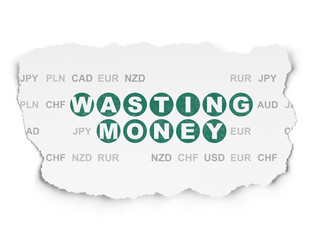 Currency concept: Wasting Money on Torn Paper background