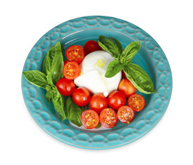 Italian buffalo mozzarella cheese with cherry tomatoes and basil.
