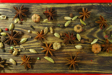 Colorful food background  -  spices on textured wood