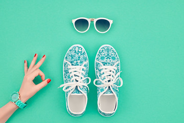 Fashion. Clothes Accessories fashion Set. Female hand OK Gesture and Stylish Trendy gumshoes, Glamor Sunglasses. Summer fashion girl Outfit, accessories. Hipster Essentials. Minimal fashion style