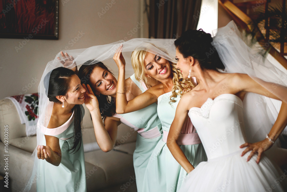 Wall mural The happinest bride with bridesmaids